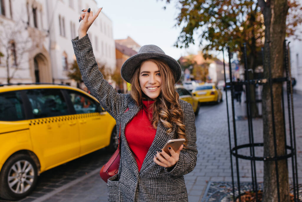 active business woman wears long tweed coat hurrying office with happy smile